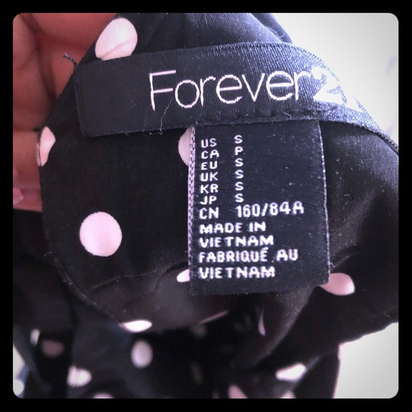 A black dress with white polka dots - Picture 2 of 3